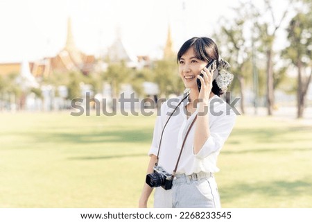 Portrait beautiful young asian woman with smartphone on summer holiday vacation trip in Thailand