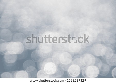 Abstract sea background, Sky and sea water bokeh, Defocused blue water surface with shiny bokeh lights.