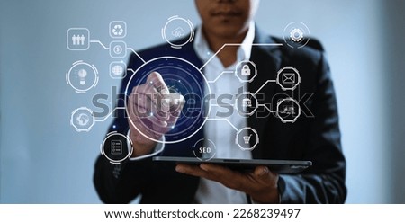 Businessman hand working digital marketing media in virtual screen with mobile phone and modern compute with VR icon diagram at office 