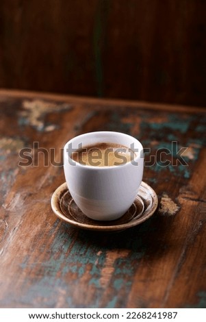 Cup of coffee on wooden background. Close up. Copy space.                                                                                         