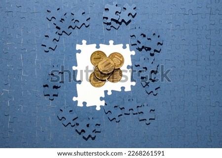 ruble coins hidden under puzzle pieces, frozen foreign exchange reserves, seized assets of Russians, confiscation of bank deposits Royalty-Free Stock Photo #2268261591
