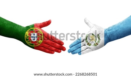 Handshake between Guatemala and Portugal flags painted on hands, isolated transparent image.