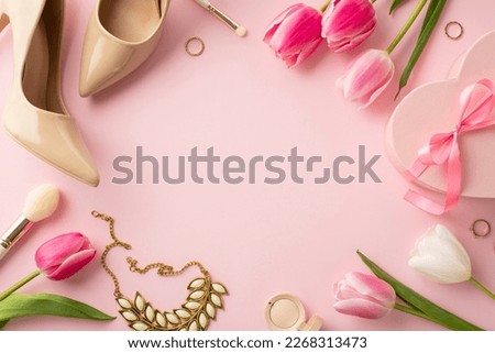 8-march concept. Top view photo of pink heart shaped giftbox with bow tulips beige high heel shoes cosmetic brushes necklace and rings on isolated pastel pink background with copyspace in the middle