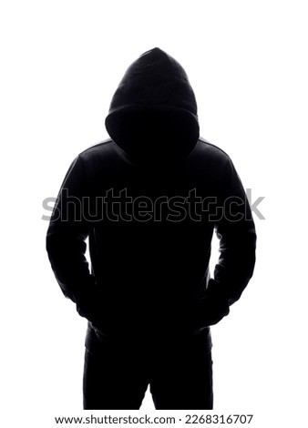 Man in Hood silhouette. Boy in a hooded sweatshirt. Isolate monochrome Photo