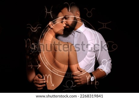 Horoscope compatibility. Loving couple and zodiac wheel on black background Royalty-Free Stock Photo #2268319841