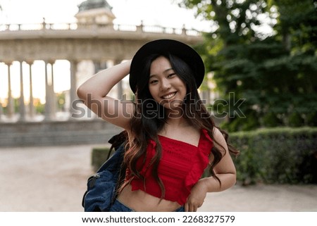 Asian woman backpacker traveler - Japanese woman with hat traveling in Europe -