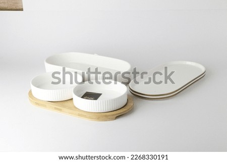 Plates, bowls, coffee mugs and kitchen utensils