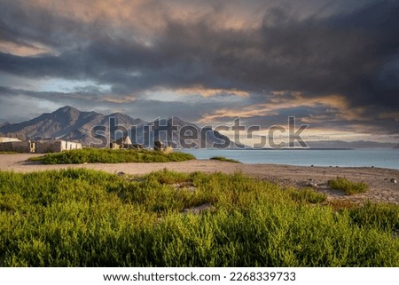 Beautiful beach side from Fujairah with mountains and sky in the background Royalty-Free Stock Photo #2268339733