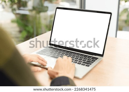 computer screen blank mockup.hand woman work using laptop with white background for advertising,contact business search information on desk at coffee shop.marketing and creative design Royalty-Free Stock Photo #2268341475