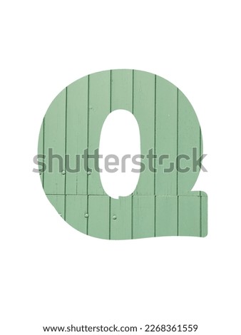 Letter Q of the alphabet made with light green wooden boards, isolated on a white background