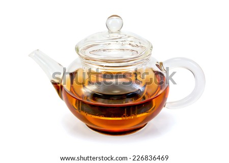 Tea in a glass teapot isolated on a white background