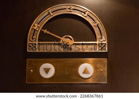 Old elevator floor indicator made of brass Royalty-Free Stock Photo #2268367861