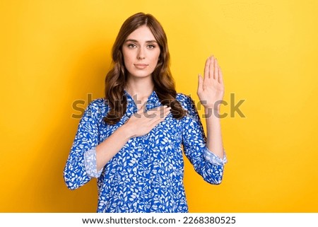 Photo of serious adorable lady wear blue trendy clothes showing arm promise defend Ukraine isolated on yellow color background Royalty-Free Stock Photo #2268380525