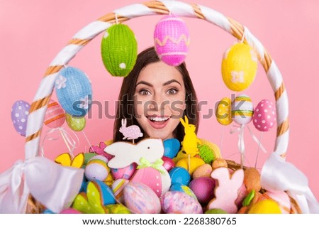 Photo of young pretty excited girl wow gift party colorful cookies isolated over pink color background
