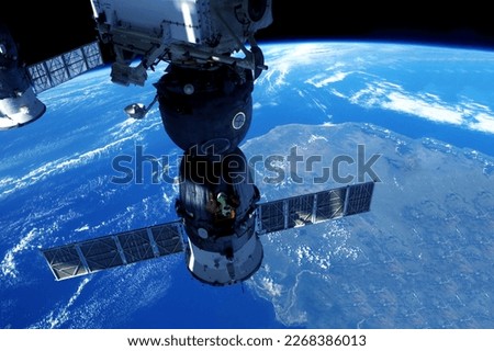 Spacecraft docked at ISS. Elements of this image were furnished by NASA. High quality photo