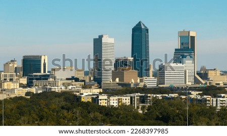 Aerial view of Jacksonville city with high office buildings. View from above of USA glass and steel high skyscraper architecture in modern american midtown