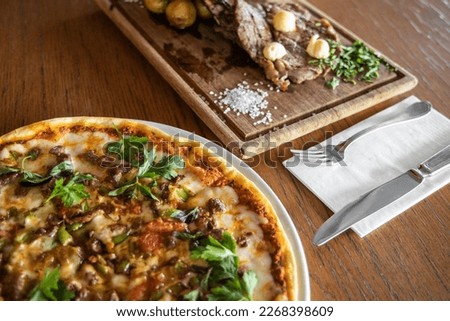 Italian pizza and steak for dinner