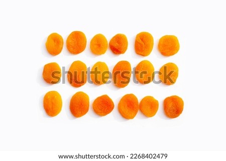 Dried apricots on white background. Royalty-Free Stock Photo #2268402479