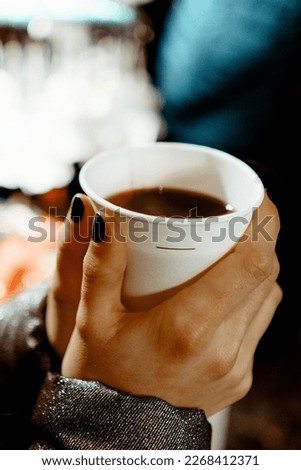 lady holding coffee cup background suitable for your designs
