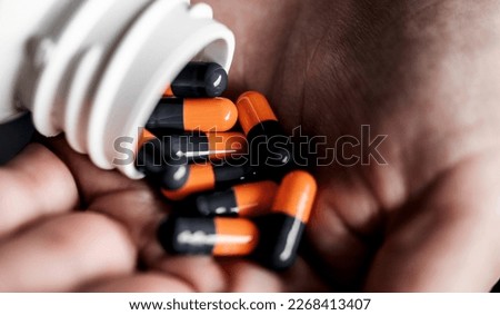 handful of pills in hand suitable for your designs as background