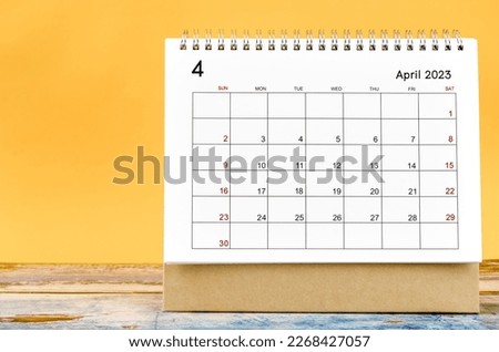 April 2023 Monthly desk calendar for 2023 year on yellow background. Royalty-Free Stock Photo #2268427057