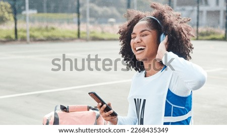 Netball sports, smartphone music or happy woman listen to mp3 radio, audio podcast or media song after fitness training. Relax wellness, digital headphones or African athlete streaming sound on court