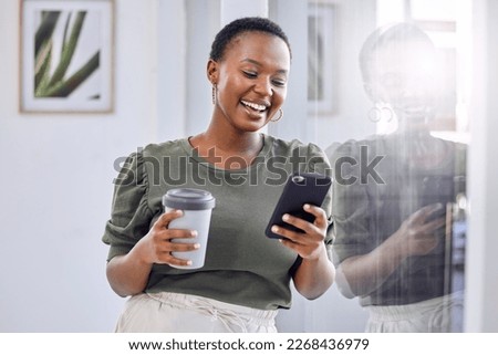 I needed a good distraction from my hectic schedule. Shot of a businesswoman drinking coffee and using her cellphone while standing in an office. Royalty-Free Stock Photo #2268436979