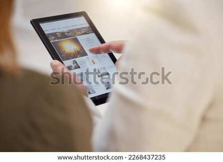Tablet, news and article with a business team reading headlines together in their office at work. Media, internet or research with a man and woman employee searching for information online Royalty-Free Stock Photo #2268437235