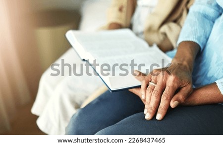 Hands, bible and senior couple praying in their home together for scripture, faith and trust. Family, worship and praise with elderly man and woman united in prayer, holy or gratitude to Jesus Christ Royalty-Free Stock Photo #2268437465