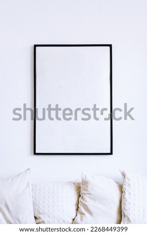 a picture frame or poster attached to the wall