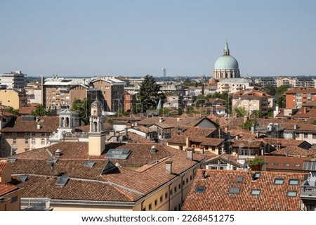 Views of the roofs of the italian city Udine and in the background the beautiful dome of the Ossuary Temple from the Piazzale del Castello. Royalty-Free Stock Photo #2268451275