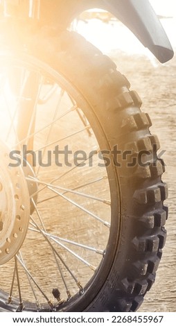 dirt bike tires exposed to the reflection of sunlight