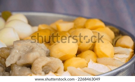 Potatoes, Tofu and Eggs steaming in a steam pot.Street food named Siomay in Indonesia