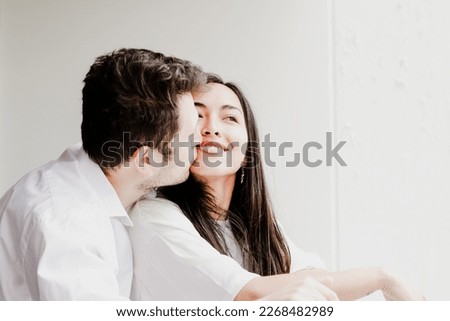 Photo of young couple enjoying, smiling, loving each other. Concept of lifestyle, human relations, love.