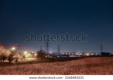 the view of the city lights from the top of the residential hill