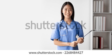 Portrait of female asian doctor standing in her office at clinic. Royalty-Free Stock Photo #2268484427
