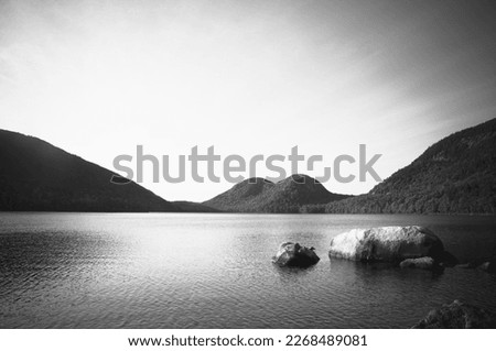 A landscape of Jordan Pond taken in Acadia National Park near Bar Harbor, Maine.  Scenic nature photography in black and white.