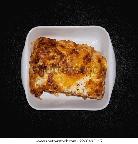 Delicious lasagna with meat, tomato sauce and cheese in in oven dish. Italian cuisine. Food picture