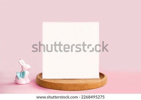 Blank Greeting Card, Invitation Mockup. Front view Easter Composition with Ceramic Bunny on Table. Copy space. Paper Spring Mock up Minimal Business Brand Template. Soft Shadow. Nordic Flier Design Ad