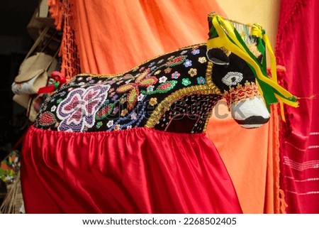 The model of an ox adorned with colored beads is the main character of the bumba boi festival in Maranhão, Brazil, Royalty-Free Stock Photo #2268502405