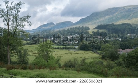 View to Blanefield, Dumgoyne and Dumfoyn hills and the Campsie Fells from the John Muir Way walking trail on Cuilt Brae, Strath Blane, Stirlingshire, Central Scotland. Royalty-Free Stock Photo #2268506021