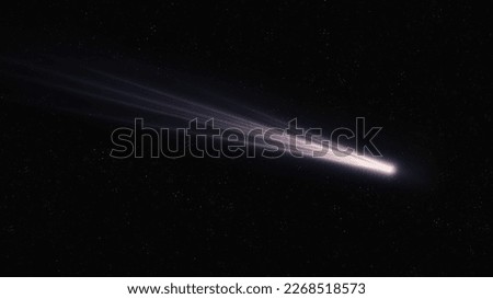Long tail of a comet glows in space. Shooting star. Real comet in the starry sky. The flight of a celestial body near the Earth. Royalty-Free Stock Photo #2268518573