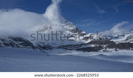Beautiful, blue sky matterhorn in clouds winter picture