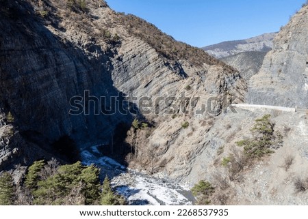 The Gorges de la Blanche, a surprising narrow defile, by which the river Blanche, also called Le Rabouis, will join the Durance. This picturesque and dizzying road leads to the Serre-Ponçon dam. Royalty-Free Stock Photo #2268537935