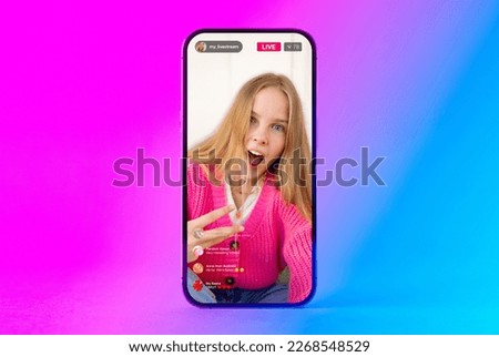 Mobile phone with sample social media live video stream on the screen Royalty-Free Stock Photo #2268548529