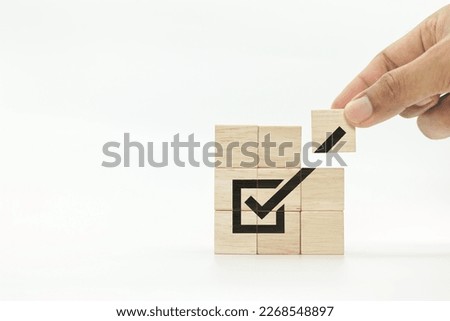 wooden cubes with checkmark icon on white background, business success.task completion. Ethical corporate. Do the right thing. Quality and ISO symbol. Royalty-Free Stock Photo #2268548897