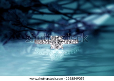 diamond engagement ring on abstract color background Royalty-Free Stock Photo #2268549055