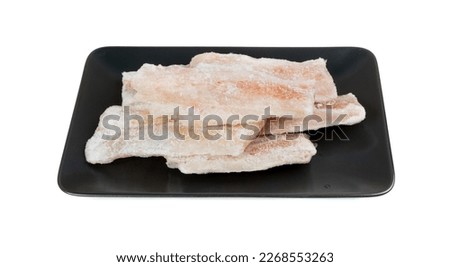 Frozen Fish on Black Isolated, White Cod Fillet, Iced Hake Filet, Frozen Pollock Meat on White Background