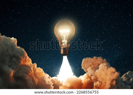 Creative rocket light bulb glows with smoke and blast successfully lift off into the starry sky space. Business start up launch and successful idea, concept. New idea and thoughts. Science Royalty-Free Stock Photo #2268556755