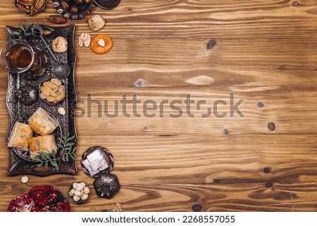 Ramadan table top view. Banner with traditional Arabic dishes, cup of tea and food sets